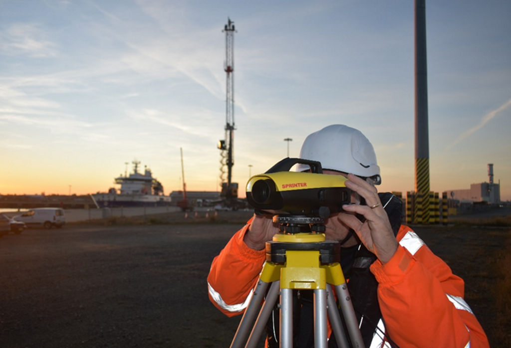 How does GNSS levelling improve tide gauge accuracy?